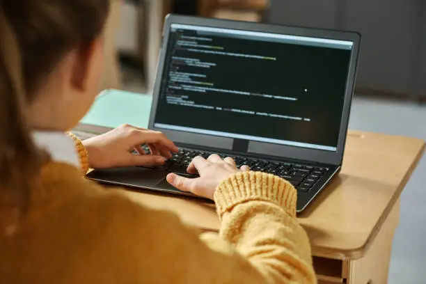 A person planning goals on a laptop